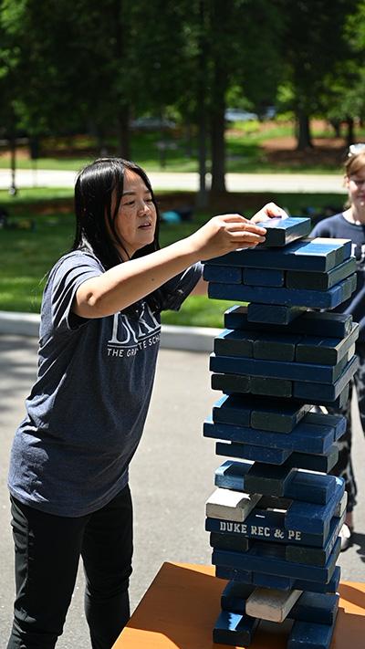 Yan Li participates in activity at Mental Health Awareness Event