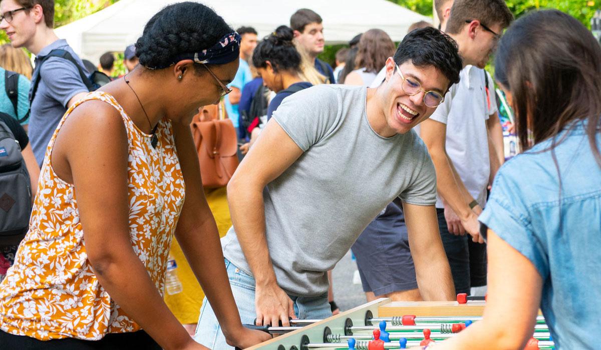 Students playing foosball