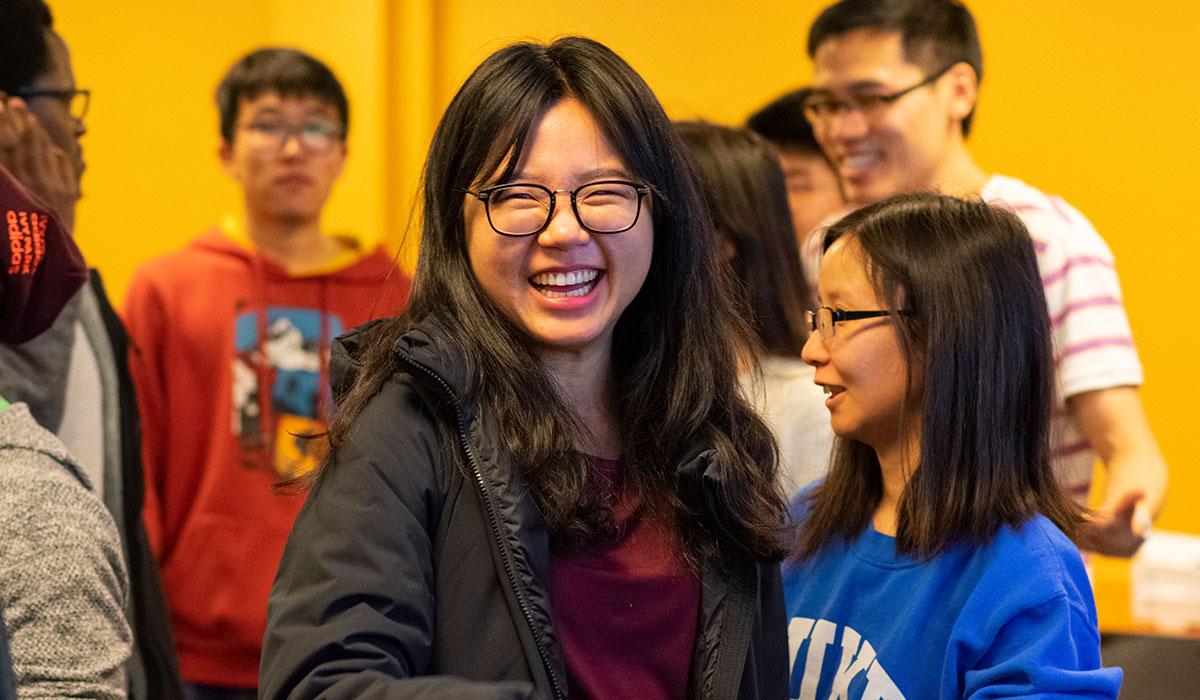 Student smiling broadly while looking straight at camera