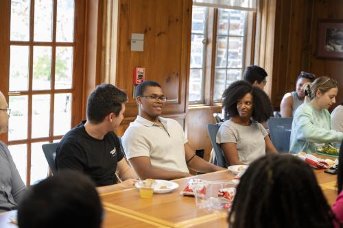 Sloan Scholars around a table for lunch