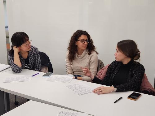 Three women participate in small-group discussion