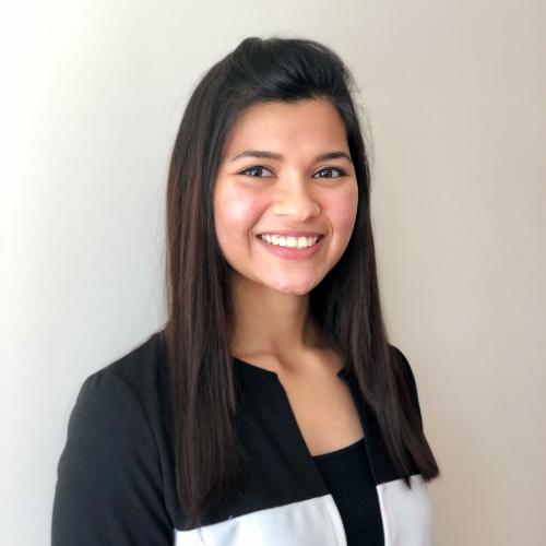 A headshot of Afsana Chowdhury smiling