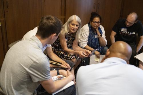 Angela Eberts engages in a small-group circle conversation