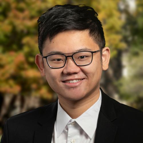 A headshot of Leo Yuan Tien smiling