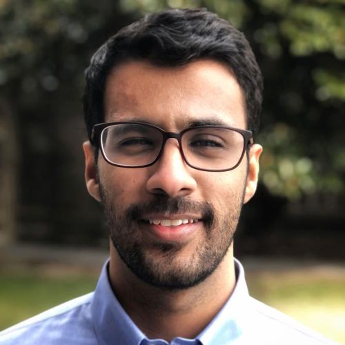 A headshot of Mohammed Alameri smiling